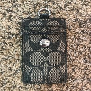 Black and grey Coach id holder